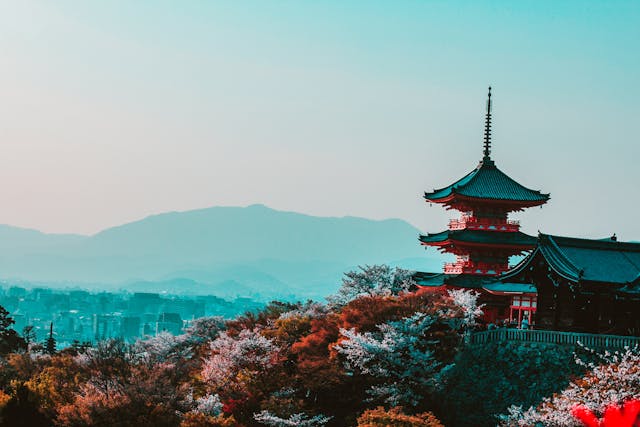 red-and-black-temple-surrounded-by-trees